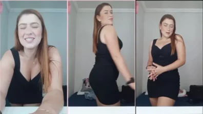 Carol analizando un vestido negro que revela un poco de su virgen